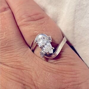 A stunningly designed ring with a triple A quality cubic zirconia in a size 7